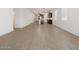 Large, open living space with wood-look tile flooring and neutral color palette at 5537 S 246Th Ave, Buckeye, AZ 85326