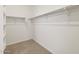 Spacious walk-in closet with ample shelving and carpeted floor at 5537 S 246Th Ave, Buckeye, AZ 85326