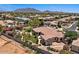 Aerial shot of a desert home highlighting the pool, well-manicured backyard, and neighborhood at 5755 S Pearl Dr, Chandler, AZ 85249