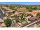 Aerial view of a sprawling home with a putting green and a backyard pool at 5755 S Pearl Dr, Chandler, AZ 85249