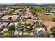 Stunning aerial view of desert home showing the pool, golf course, and lush landscaping at 5755 S Pearl Dr, Chandler, AZ 85249