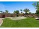Well-manicured backyard featuring a putting green and tasteful shrubbery at 5755 S Pearl Dr, Chandler, AZ 85249