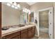 Bathroom featuring double sinks, tile countertop, and shower at 5755 S Pearl Dr, Chandler, AZ 85249