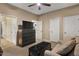Neutral bedroom with modern ceiling fan and closet doors at 5755 S Pearl Dr, Chandler, AZ 85249
