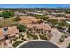 Sprawling single-story home with lush landscaping, manicured lawns, and a circular driveway at 5755 S Pearl Dr, Chandler, AZ 85249