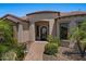 Elegant entrance with brick walkway, lush landscaping and wrought iron door at 5755 S Pearl Dr, Chandler, AZ 85249