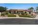 Well-maintained front yard with manicured lawn, desert landscaping, and charming brick walkway at 5755 S Pearl Dr, Chandler, AZ 85249