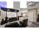 Home theater with a large screen, overhead projector, recliner seating, pool table and surround sound speakers at 5755 S Pearl Dr, Chandler, AZ 85249