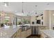 The kitchen includes stainless appliances, granite counters, a center island, and backyard views at 5755 S Pearl Dr, Chandler, AZ 85249