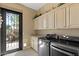 Laundry room with granite counter tops and stainless steel appliances at 5755 S Pearl Dr, Chandler, AZ 85249
