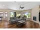 Open living room with backyard views and a cozy fireplace, great for relaxing at 5755 S Pearl Dr, Chandler, AZ 85249