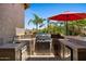 Outdoor kitchen with stainless steel appliances, a sink, and a grill at 5755 S Pearl Dr, Chandler, AZ 85249
