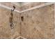 Beautifully tiled walk-in shower with adjustable shower head and convenient built-in niche for storage at 5755 S Pearl Dr, Chandler, AZ 85249