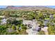 An aerial shot of the estate with lush landscaping, a swimming pool and mountain views at 6467 E Sierra Vista Dr, Paradise Valley, AZ 85253