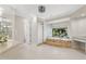 Spacious bathroom features a soaking tub, glass-block window, tiled floors, and neutral decor at 6467 E Sierra Vista Dr, Paradise Valley, AZ 85253