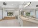 Well-lit bathroom features dual sinks, a soaking tub with views, and a neutral color scheme at 6467 E Sierra Vista Dr, Paradise Valley, AZ 85253