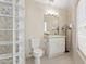 Bathroom showcasing tiled flooring, decorative glass blocks, and a vanity at 6467 E Sierra Vista Dr, Paradise Valley, AZ 85253