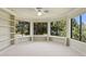 Bright bedroom with built-in shelving and large windows overlooking lush landscaping at 6467 E Sierra Vista Dr, Paradise Valley, AZ 85253