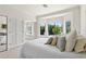 This relaxing bedroom includes a bed with soft pillows, a window seat, and a mirrored closet at 6467 E Sierra Vista Dr, Paradise Valley, AZ 85253