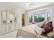 Comfortable bedroom featuring a sitting area in the bay window and dresser at 6467 E Sierra Vista Dr, Paradise Valley, AZ 85253