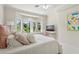 Well-lit bedroom with scenic views, a bed with pink pillows, and study area at 6467 E Sierra Vista Dr, Paradise Valley, AZ 85253