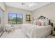 Cozy bedroom with view of outside, featuring a tufted headboard and side table at 6467 E Sierra Vista Dr, Paradise Valley, AZ 85253