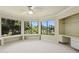Bright bedroom with built-in shelving, desk, and large windows overlooking lush landscaping at 6467 E Sierra Vista Dr, Paradise Valley, AZ 85253