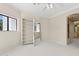 Bedroom with natural light, neutral walls and carpet, and built-in shelves at 6467 E Sierra Vista Dr, Paradise Valley, AZ 85253