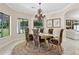 Elegant dining room featuring a vintage chandelier and floral-patterned chairs at 6467 E Sierra Vista Dr, Paradise Valley, AZ 85253
