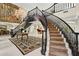 Elegant foyer featuring a curved staircase and chandelier at 6467 E Sierra Vista Dr, Paradise Valley, AZ 85253