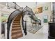 Elegant foyer with a curved staircase, chandelier, and stylish decor at 6467 E Sierra Vista Dr, Paradise Valley, AZ 85253