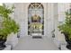 Spacious foyer featuring a grand chandelier, staircase, and exquisite architectural details at 6467 E Sierra Vista Dr, Paradise Valley, AZ 85253