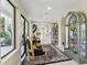Spacious hallway featuring display cases with seating, stairs, and multiple entryways at 6467 E Sierra Vista Dr, Paradise Valley, AZ 85253