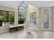 Hallway with spiral staircase, bench, and views of the exterior at 6467 E Sierra Vista Dr, Paradise Valley, AZ 85253