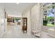 Hallway featuring a spiral staircase and a glimpse into the living area at 6467 E Sierra Vista Dr, Paradise Valley, AZ 85253