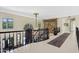 Hallway with decorative rug, tapestry, and black handrails at 6467 E Sierra Vista Dr, Paradise Valley, AZ 85253