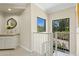 Hallway with exterior views, counter and round mirror at 6467 E Sierra Vista Dr, Paradise Valley, AZ 85253