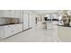 Expansive white kitchen with a center island, built-in appliances, and plenty of storage space at 6467 E Sierra Vista Dr, Paradise Valley, AZ 85253