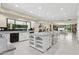 Open kitchen with a granite island, white cabinets, and stainless steel appliances at 6467 E Sierra Vista Dr, Paradise Valley, AZ 85253