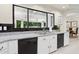 Bright kitchen featuring stainless steel sink, granite counters, and black appliances at 6467 E Sierra Vista Dr, Paradise Valley, AZ 85253