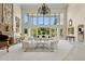 Elegant living room featuring floor-to-ceiling windows with views of the pool area and an open floor plan at 6467 E Sierra Vista Dr, Paradise Valley, AZ 85253