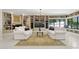 Cozy living room with custom built-in bookshelves and comfortable white sofas at 6467 E Sierra Vista Dr, Paradise Valley, AZ 85253