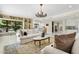 Comfortable living space with large windows, built-in shelving and seamless flow to other rooms at 6467 E Sierra Vista Dr, Paradise Valley, AZ 85253