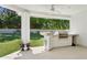 Backyard with a built-in outdoor grill and countertop, surrounded by a well-maintained lawn at 6467 E Sierra Vista Dr, Paradise Valley, AZ 85253