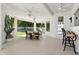 Covered patio with ceiling fans, dining area, and seating, perfect for outdoor entertaining at 6467 E Sierra Vista Dr, Paradise Valley, AZ 85253