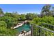 Beautiful pool area with lush landscaping, a rock waterfall feature and lounge seating at 6467 E Sierra Vista Dr, Paradise Valley, AZ 85253