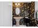 Ornate powder room featuring a pedestal sink, decorative wallpaper, and a vintage mirror at 6467 E Sierra Vista Dr, Paradise Valley, AZ 85253