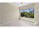 A sunlit room with a large window showcasing serene mountain and greenery views at 6467 E Sierra Vista Dr, Paradise Valley, AZ 85253