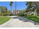 Luxury home featuring lush landscaping, green lawns, and mature trees at 6467 E Sierra Vista Dr, Paradise Valley, AZ 85253