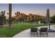 Backyard lounge area with manicured turf, and scenic views of the mountains at 7100 N 47Th St, Paradise Valley, AZ 85253